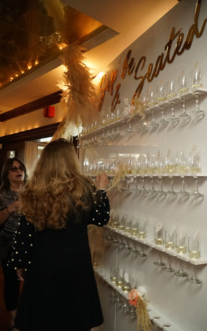 Sip and Be Seated Champagne Wall