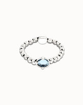 Sterling Silver Plated Metal Beaded Bracelet With A Blue Faceted Crystals And Elastic String