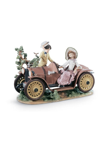 Young Couple With Car Sculpture. Limited Edition