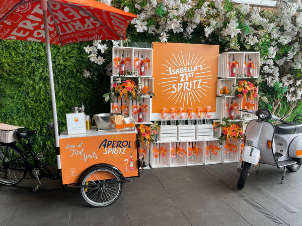 Crate Backdrop w/Custom sign, 4 floral arrangements, 4 orange mini arrangements