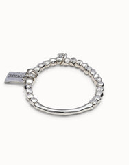 Beaded Stretch Bracelet With Tubular Piece And A Charm