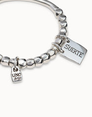 Beaded Stretch Bracelet With Tubular Piece And A Charm