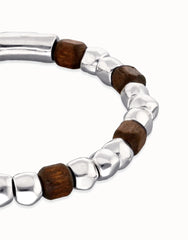 Metal Alloy Elastic Beaded Bracelets Plated In Sterling Silver And Beads In Wood