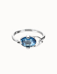 Rigid Bracelet Of Metal Alloy Plated In Sterling Silver With A Blue Faceted Crystal
