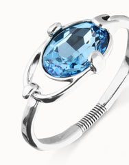 Rigid Bracelet Of Metal Alloy Plated In Sterling Silver With A Blue Faceted Crystal