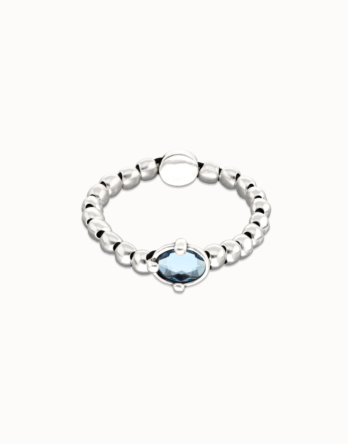 Sterling Silver Plated Metal Beaded Bracelet With A Blue Faceted Crystals And Elastic String
