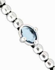Sterling Silver Plated Metal Beaded Bracelet With A Blue Faceted Crystals And Elastic String
