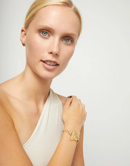 Metal Alloy Semi Rigid Bracelet Plated In 18K Gold With Heart Detail